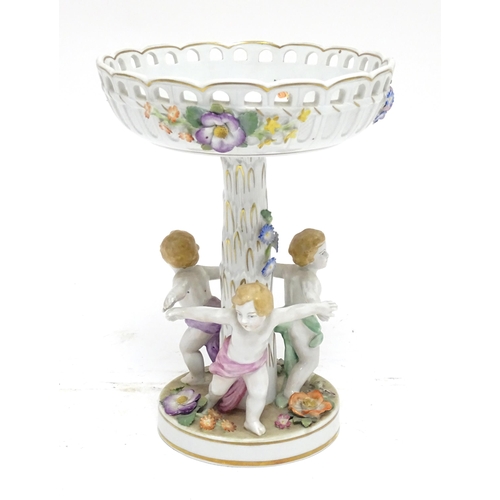 88 - A German Schierholz Plaue centrepiece / comport of pedestal form, the base with children dancing, th... 