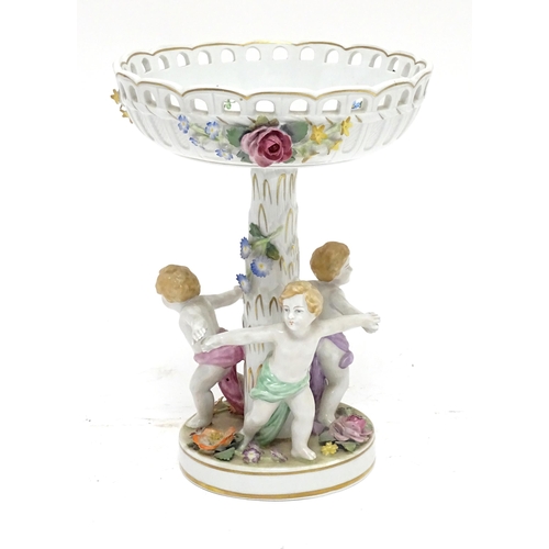 88 - A German Schierholz Plaue centrepiece / comport of pedestal form, the base with children dancing, th... 