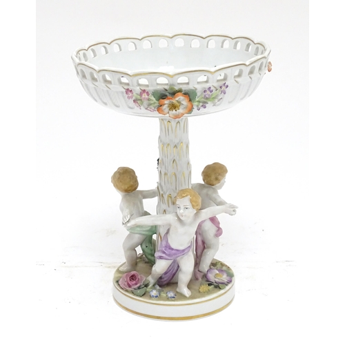 88 - A German Schierholz Plaue centrepiece / comport of pedestal form, the base with children dancing, th... 