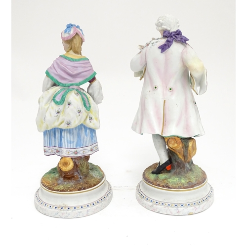 92 - A pair of French bisque porcelain male and female figures on naturalistic circular. Impressed A.M. m... 