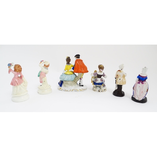 183 - A quantity of Continental figures to include a figural group modelled as a couple in the manner of S... 