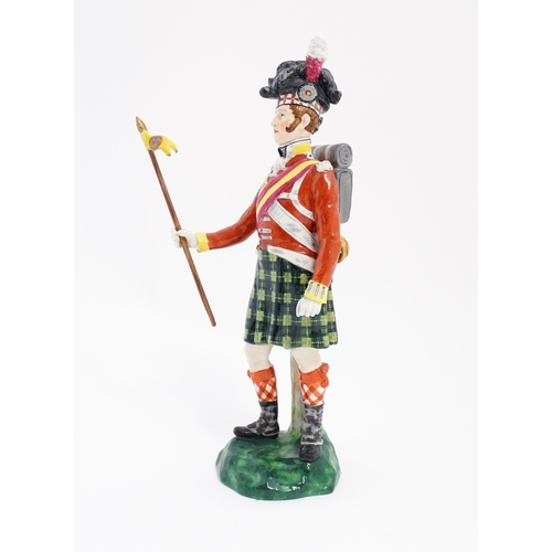 185 - A Copeland figure modelled as a Gordon Highlanders soldier, retailed by T. Goode & Co. Approx. 11