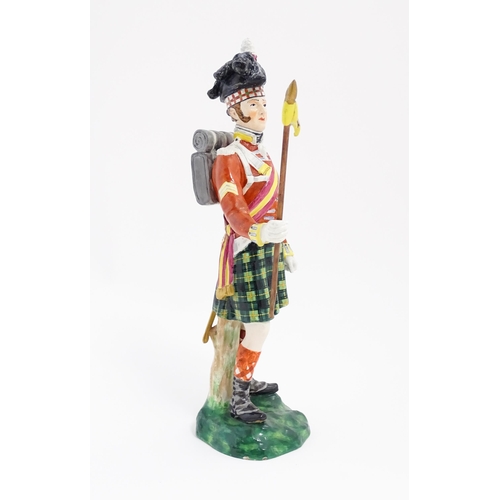 185 - A Copeland figure modelled as a Gordon Highlanders soldier, retailed by T. Goode & Co. Approx. 11