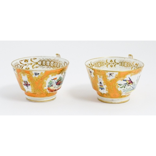 188 - Two 19thC English tea cups and saucers the orange ground decorated with hand painted exotic birds an... 