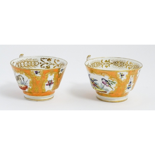 188 - Two 19thC English tea cups and saucers the orange ground decorated with hand painted exotic birds an... 