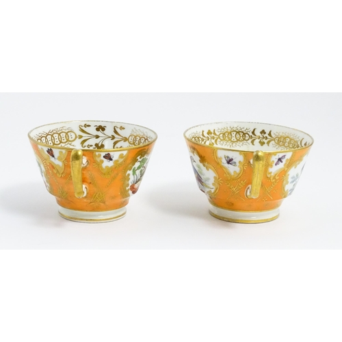 188 - Two 19thC English tea cups and saucers the orange ground decorated with hand painted exotic birds an... 