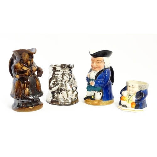 195 - Three assorted Toby / character jugs to include a treacle glaze example, a lustre jug, and a musical... 