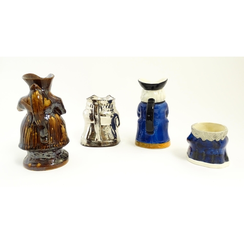 195 - Three assorted Toby / character jugs to include a treacle glaze example, a lustre jug, and a musical... 