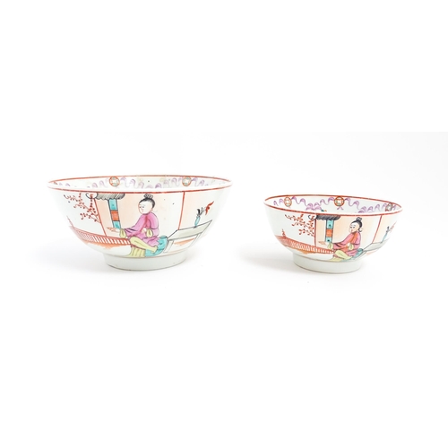 198 - Two New Hall style bowls with chinoiserie decoration depicting figures on a terrace, with swag and b... 