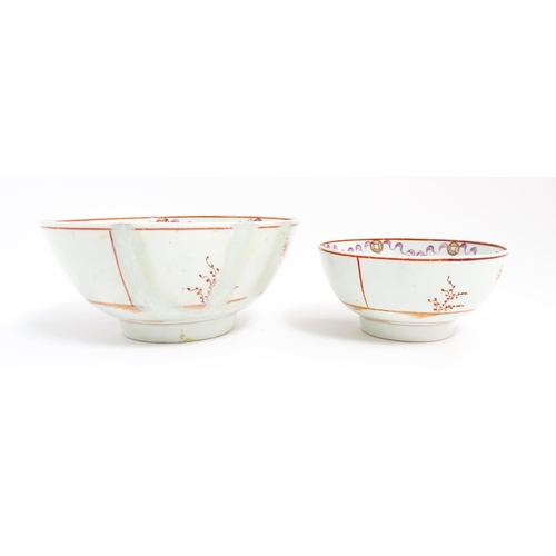 198 - Two New Hall style bowls with chinoiserie decoration depicting figures on a terrace, with swag and b... 