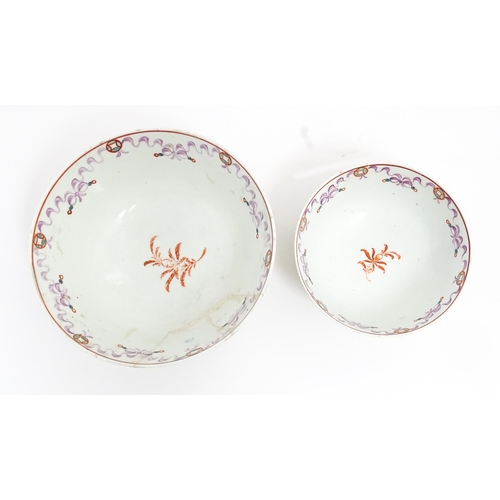 198 - Two New Hall style bowls with chinoiserie decoration depicting figures on a terrace, with swag and b... 