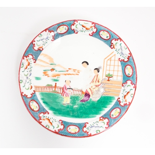 199 - A Minton style footed comport / tazza with chinoiserie decoration depicting three figures on a terra... 