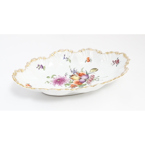 200 - A Dresden dish of shaped form with hand painted decoration depicting a floral spray further bordered... 