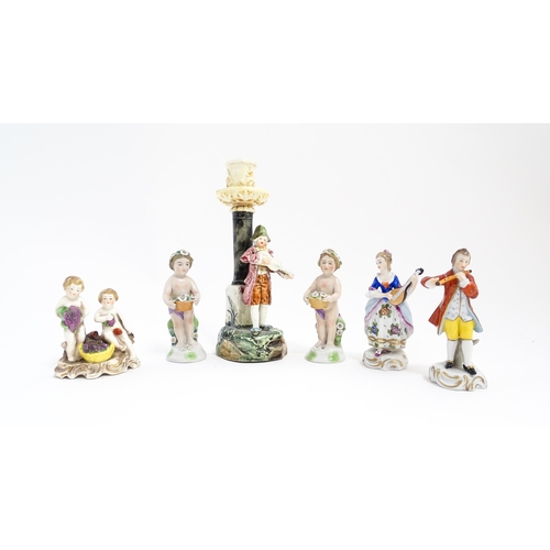 203 - Six Continental figures to include a Sitzendorf model of a lady playing the mandolin, two putti / ch... 