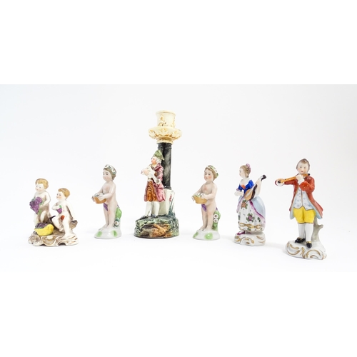 203 - Six Continental figures to include a Sitzendorf model of a lady playing the mandolin, two putti / ch... 