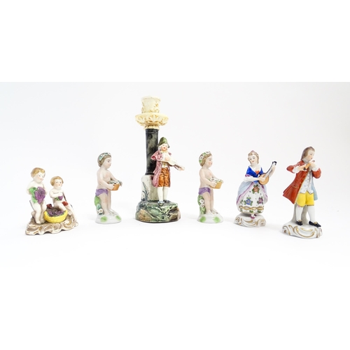 203 - Six Continental figures to include a Sitzendorf model of a lady playing the mandolin, two putti / ch... 