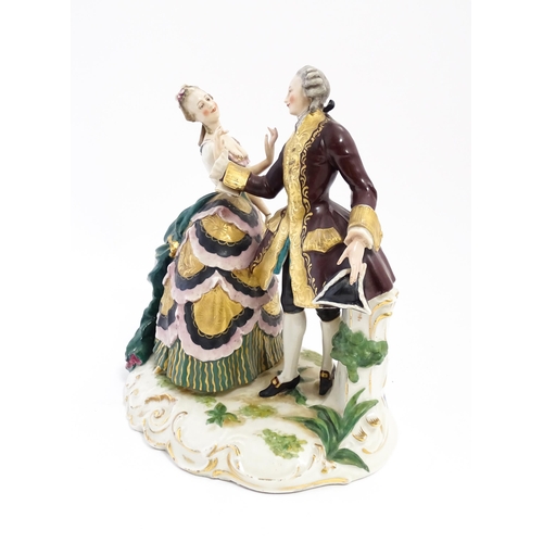 215 - A Continental figure group modelled as a young couple dancing. Approx. 11 1/4