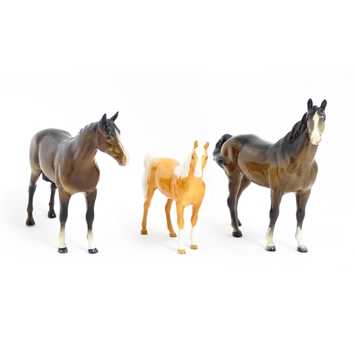 121 - Three Beswick models of horses comprising a brown horse with swish tail, no. 1182, a brown imperial,... 