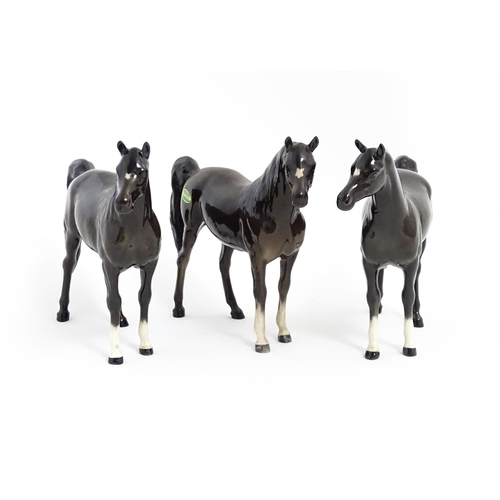 126 - Three Beswick models of dark brown Arab horses. Approx. 6