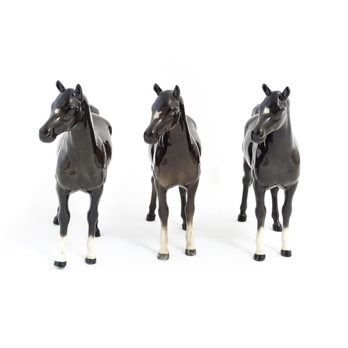 126 - Three Beswick models of dark brown Arab horses. Approx. 6