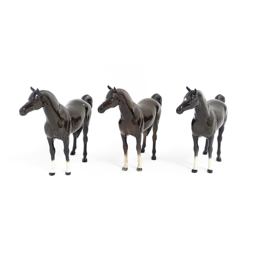 126 - Three Beswick models of dark brown Arab horses. Approx. 6