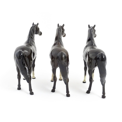 126 - Three Beswick models of dark brown Arab horses. Approx. 6