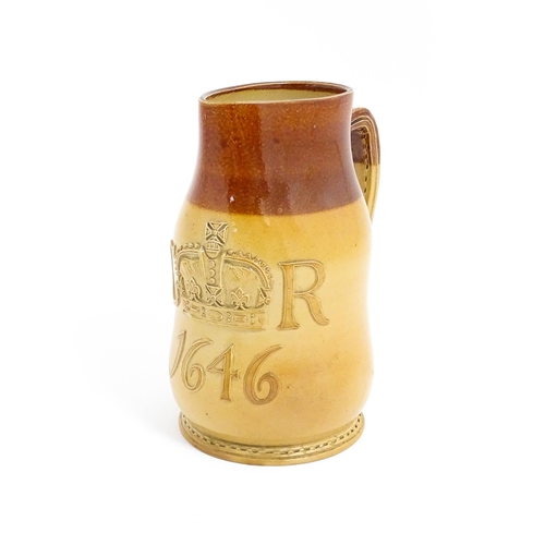 169 - A Doulton Lambeth jug of leather jack form with commemorative CR cipher dated 1646. Marked under no.... 