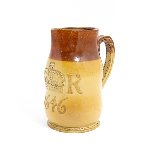 169 - A Doulton Lambeth jug of leather jack form with commemorative CR cipher dated 1646. Marked under no.... 