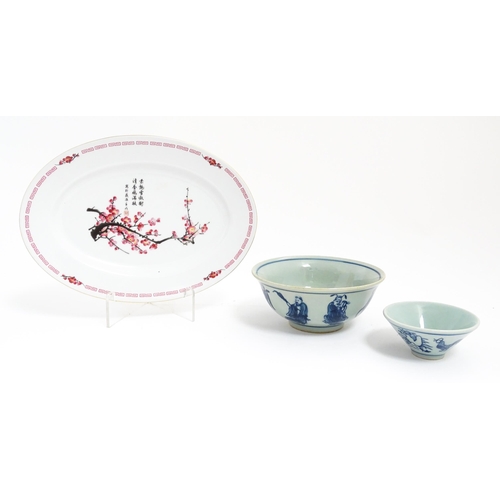 29 - Three Oriental items comprising a blue and white bowl decorated with the eight immortals, a sake bow... 