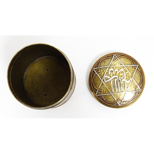 1070 - An early 20thC Middle Eastern brass pot and cover with engraved detail and inlaid white metal and co... 