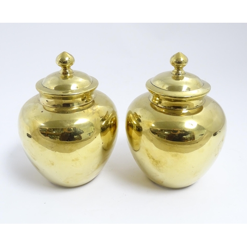 1071 - A pair of Chinese brass lidded ginger jars. Character marks under. Approx. 7 1/2