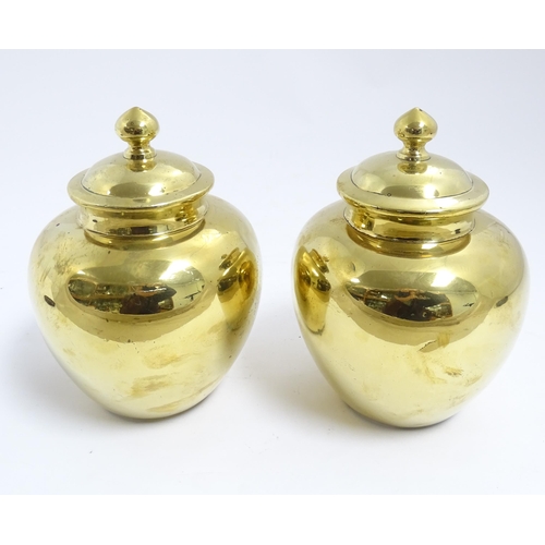 1071 - A pair of Chinese brass lidded ginger jars. Character marks under. Approx. 7 1/2