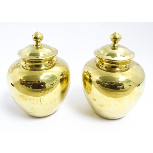 1071 - A pair of Chinese brass lidded ginger jars. Character marks under. Approx. 7 1/2