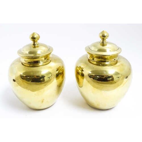 1071 - A pair of Chinese brass lidded ginger jars. Character marks under. Approx. 7 1/2