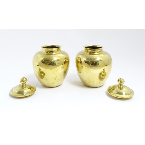 1071 - A pair of Chinese brass lidded ginger jars. Character marks under. Approx. 7 1/2