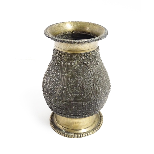 1072 - An Indian brass vase with banded figural and floral detail. Approx. 4 1/2