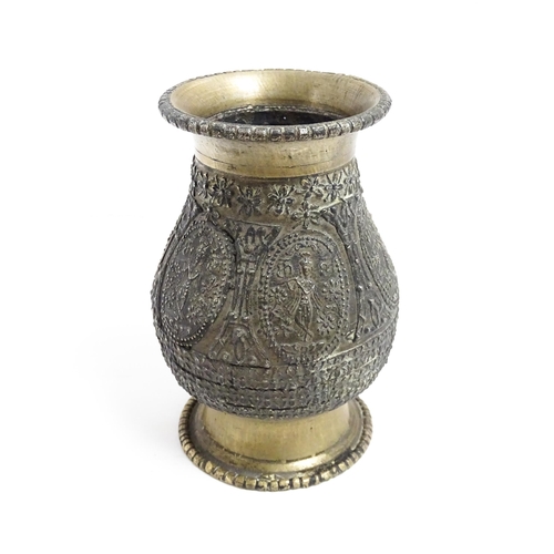 1072 - An Indian brass vase with banded figural and floral detail. Approx. 4 1/2