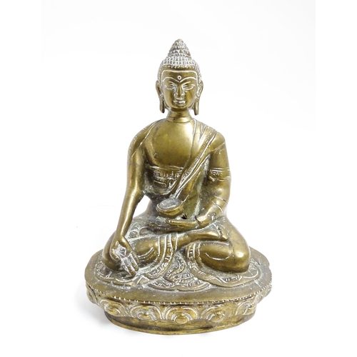 1074 - A cast brass model of a seated Buddha. Approx. 7 1/4