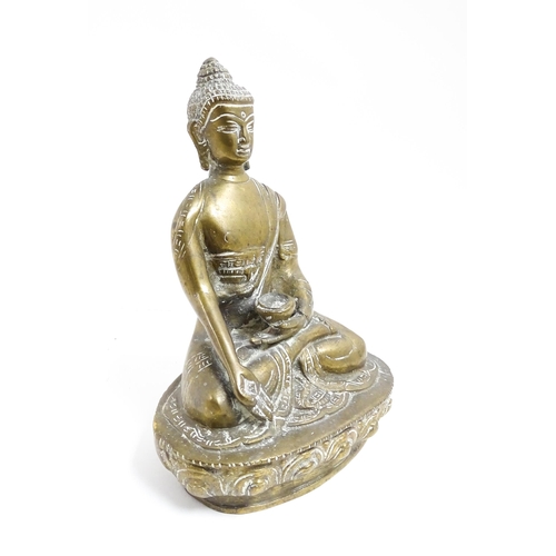 1074 - A cast brass model of a seated Buddha. Approx. 7 1/4