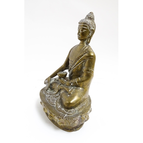 1074 - A cast brass model of a seated Buddha. Approx. 7 1/4