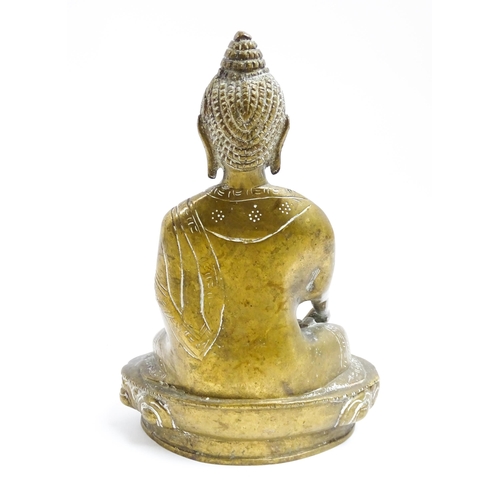 1074 - A cast brass model of a seated Buddha. Approx. 7 1/4