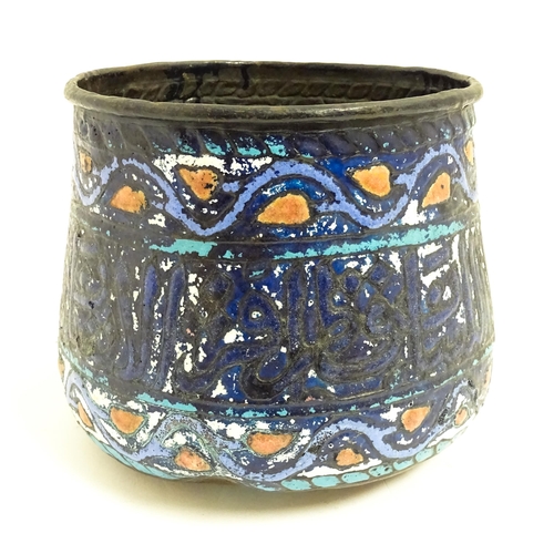 1083 - An Islamic copper planter with banded enamel decoration. Approx. 7 1/2