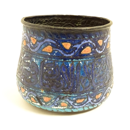 1083 - An Islamic copper planter with banded enamel decoration. Approx. 7 1/2