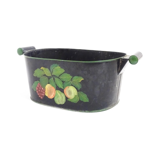 1085 - A Victorian toleware planter with twin handles and hand painted fruit and vine decoration. Approx. 8... 