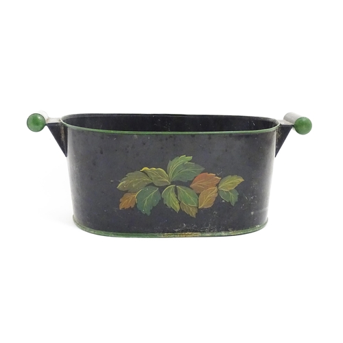 1085 - A Victorian toleware planter with twin handles and hand painted fruit and vine decoration. Approx. 8... 