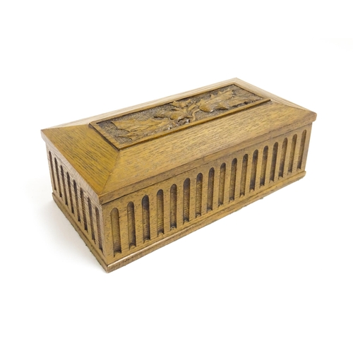 1086 - A 20thC oak box of rectangular form with carved thistle detail. Approx. 3 1/2