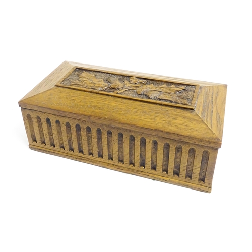 1086 - A 20thC oak box of rectangular form with carved thistle detail. Approx. 3 1/2