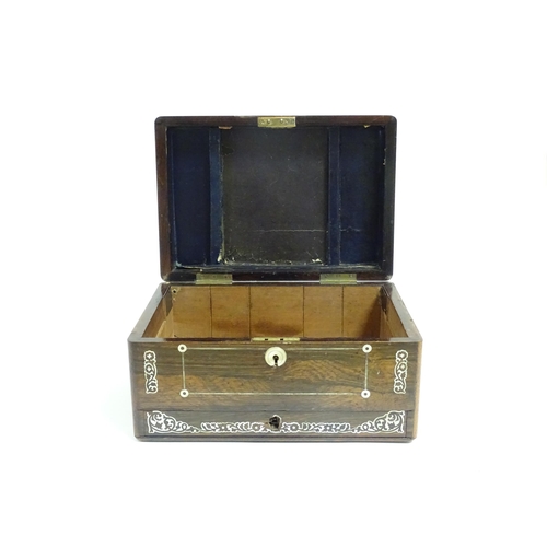 1087 - A Victorian rosewood workbox with drawer under, the exterior decorated with mother of pearl inlay. A... 