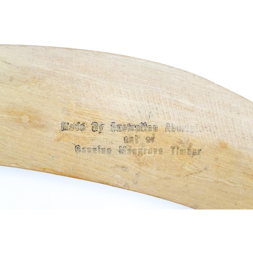 1104 - An Australian Aboriginal mangrove timber souvenir boomerang titled Greetings from Australia with kan... 