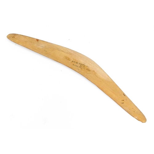 1104 - An Australian Aboriginal mangrove timber souvenir boomerang titled Greetings from Australia with kan... 